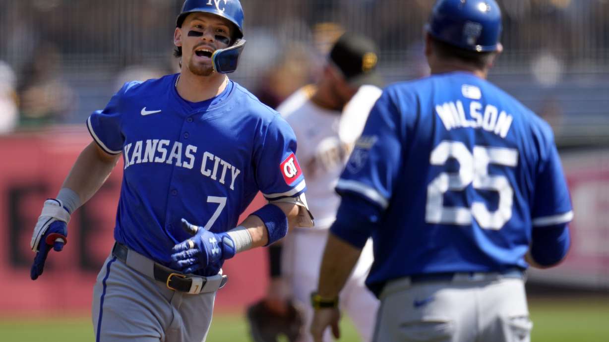 Kansas City Royals' Bobby Witt Jr. (7) rounds third to greetings from third base coach Vance Wilson (25) after hitting a solo home run off Pittsburgh Pirates starting pitcher Mitch Keller during the first inning of a baseball game in Pittsburgh, Saturday, Sept. 14, 2024.