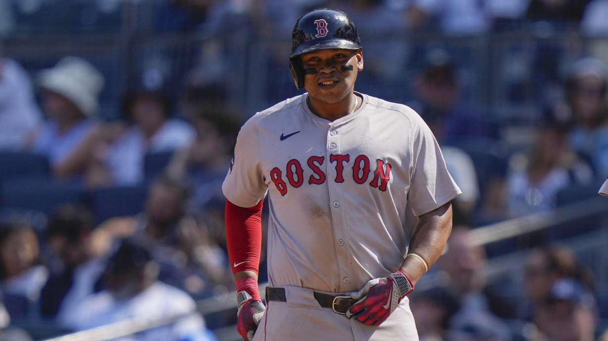 Boston Red Sox's Rafael Devers smiles after hitting a two-run single during the fifth inning of a baseball game against the New York Yankees, Saturday, Sept. 14, 2024, in New York.