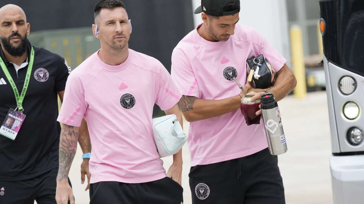Inter Miami forwards Lionel Messi, left, and Luis Suarez arrive for an MLS soccer match against the Philadelphia Union, Saturday, Sept. 14, 2024, in Fort Lauderdale, Fla.