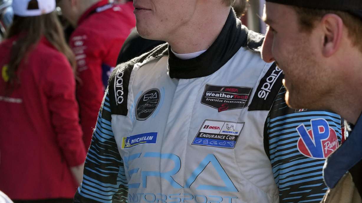 FILE - Connor Zilisch greets team members after the Rolex 24-hour auto race at Daytona International Speedway, Jan. 28, 2024, in Daytona Beach, Fla.