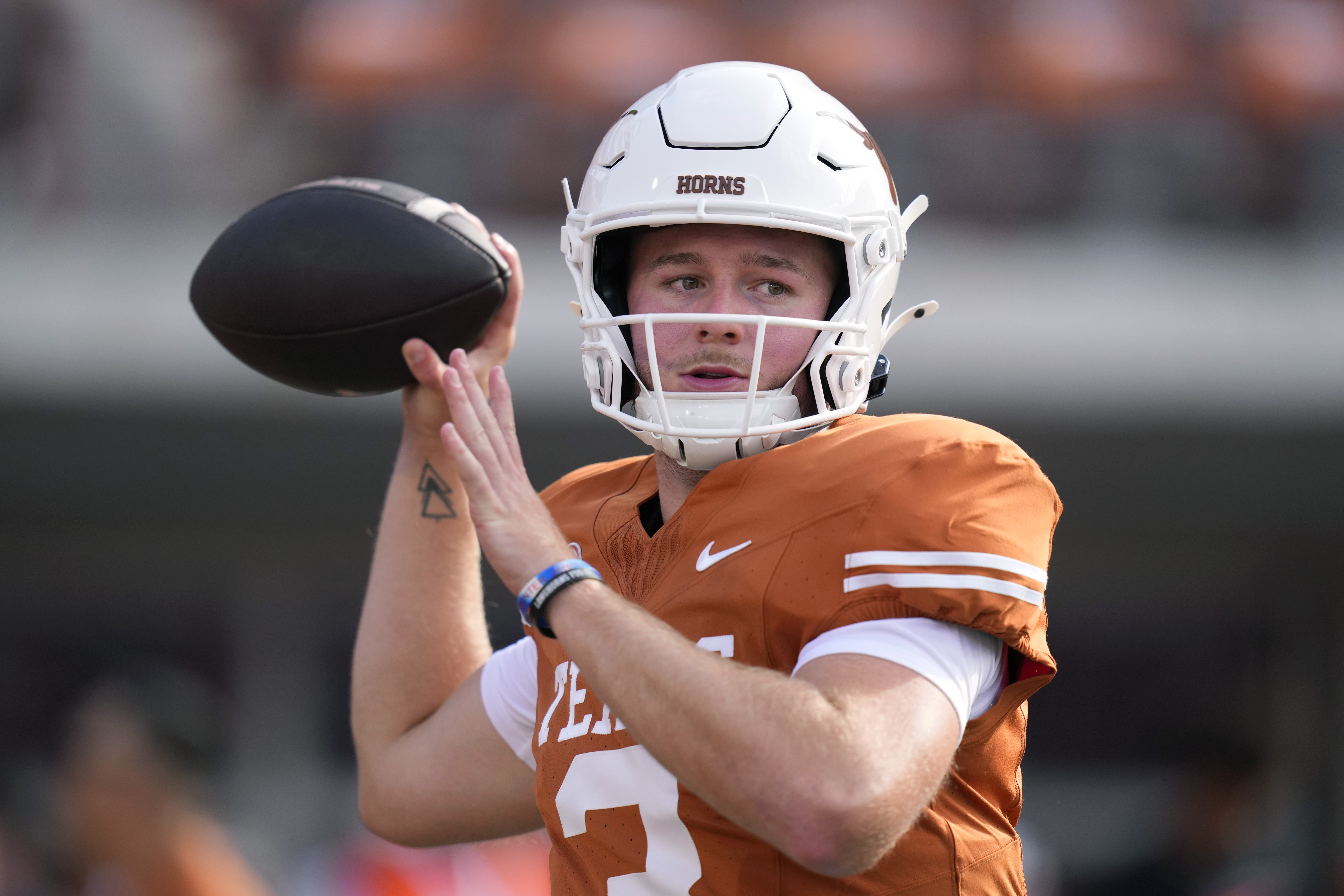 Texas quarterback Quinn Ewers (3) throws before an NCAA college football game against UTSA in Austin, Texas, Saturday, Sept. 14, 2024.