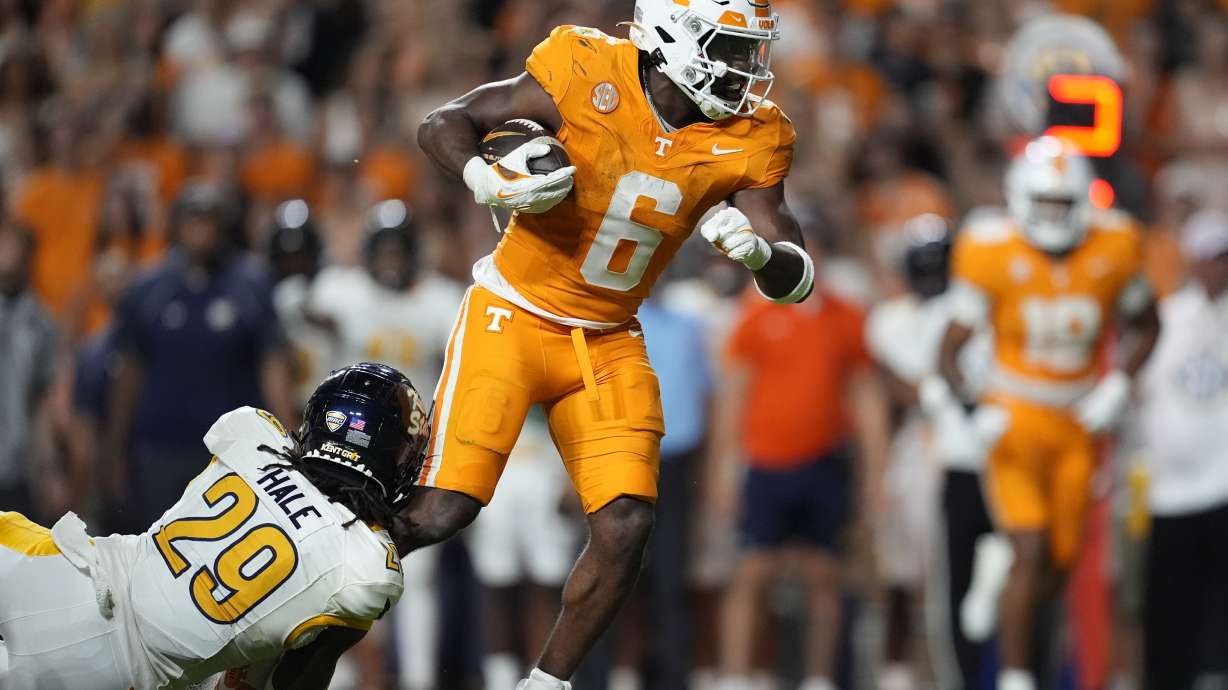 Tennessee running back Dylan Sampson (6) runs the ball past Kent State defensive back Armahn Hale (29) during the first half of an NCAA college football game Saturday, Sept. 14, 2024, in Knoxville, Tenn.