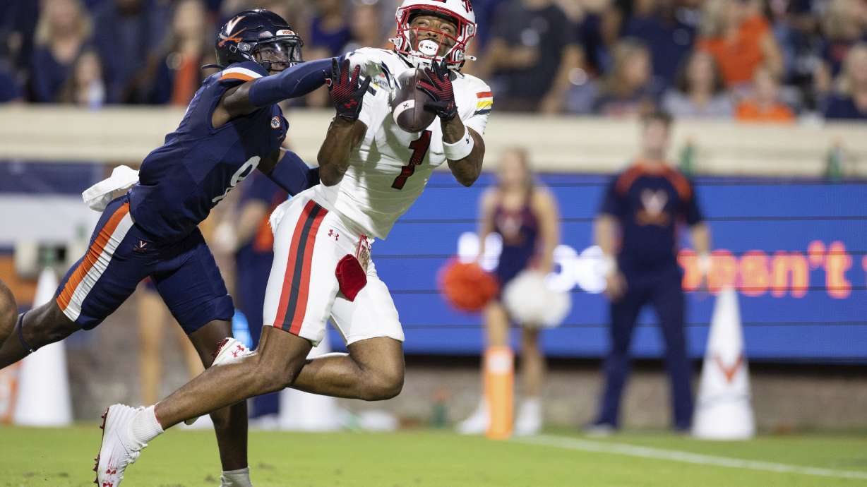 Maryland wide receiver Kaden Prather (1) tries to make a catch while defended by Virginia Cavaliers cornerback Jam Jackson (9) during the first half of an NCAA college football game, Saturday, Sept. 14, 2024, in Charlottesville, Va.