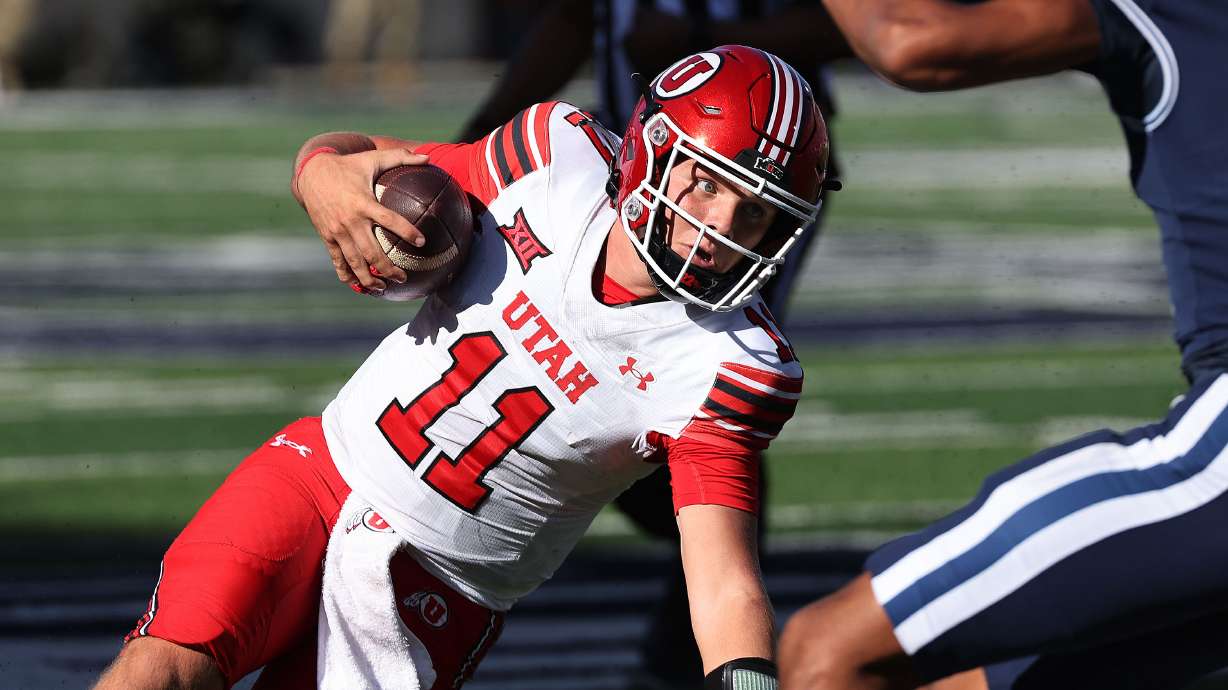 Utah Utes quarterback Isaac Wilson (11) runs against USU in Logan on Saturday, Sept. 14, 2024.