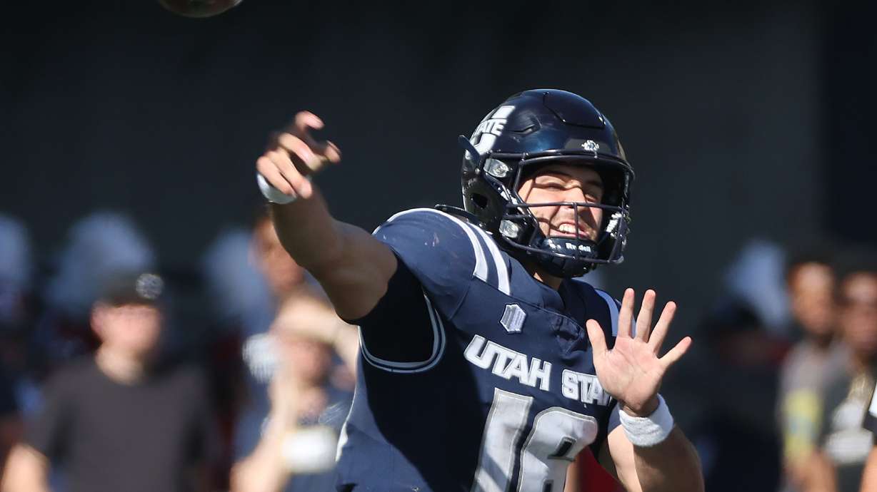 Utah State Aggies quarterback Bryson Barnes (16) throws against Utah in Logan on Saturday, Sept. 14, 2024.