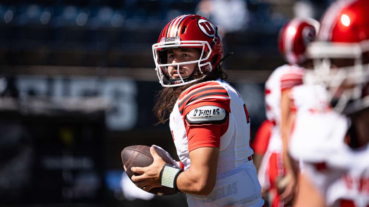 Utah quarterback Cam Rising goes through drills ahead of a game against Utah State at Maverik Stadium on Sept. 14, 2024.