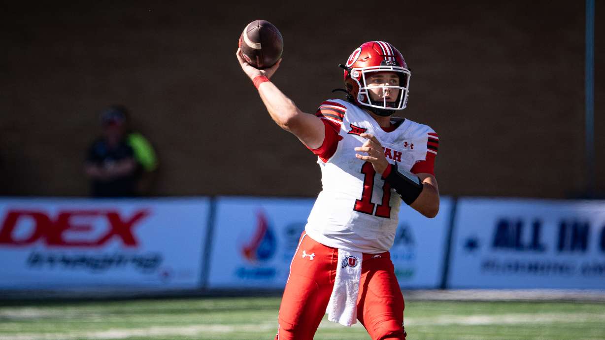 Utah quarterback Isaac Wilson throws a pass against Utah State at Maverik Stadium in Logan on Sept. 14, 2024.