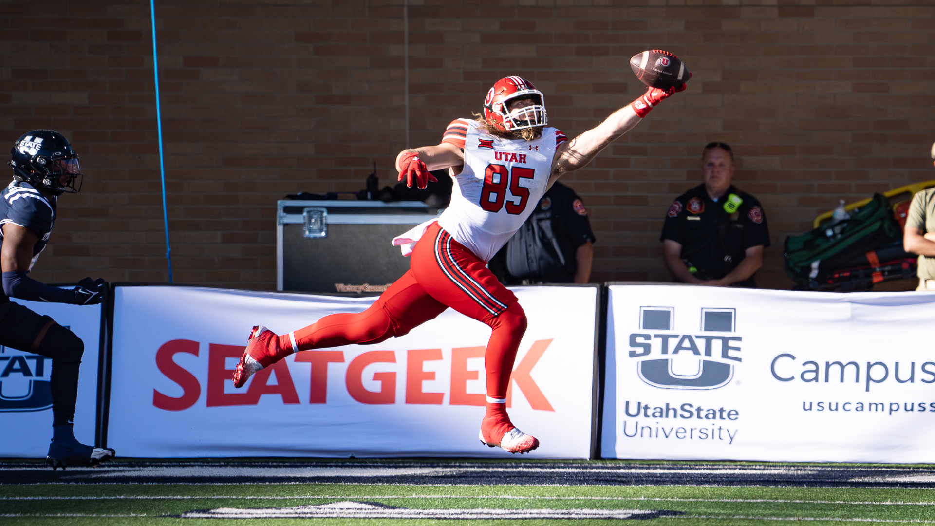 Utah tight end Carsen Ryan pulls down a one-handed catch for a touchdown against Utah State at Maverik Stadium in Logan on Sept. 14, 2024.