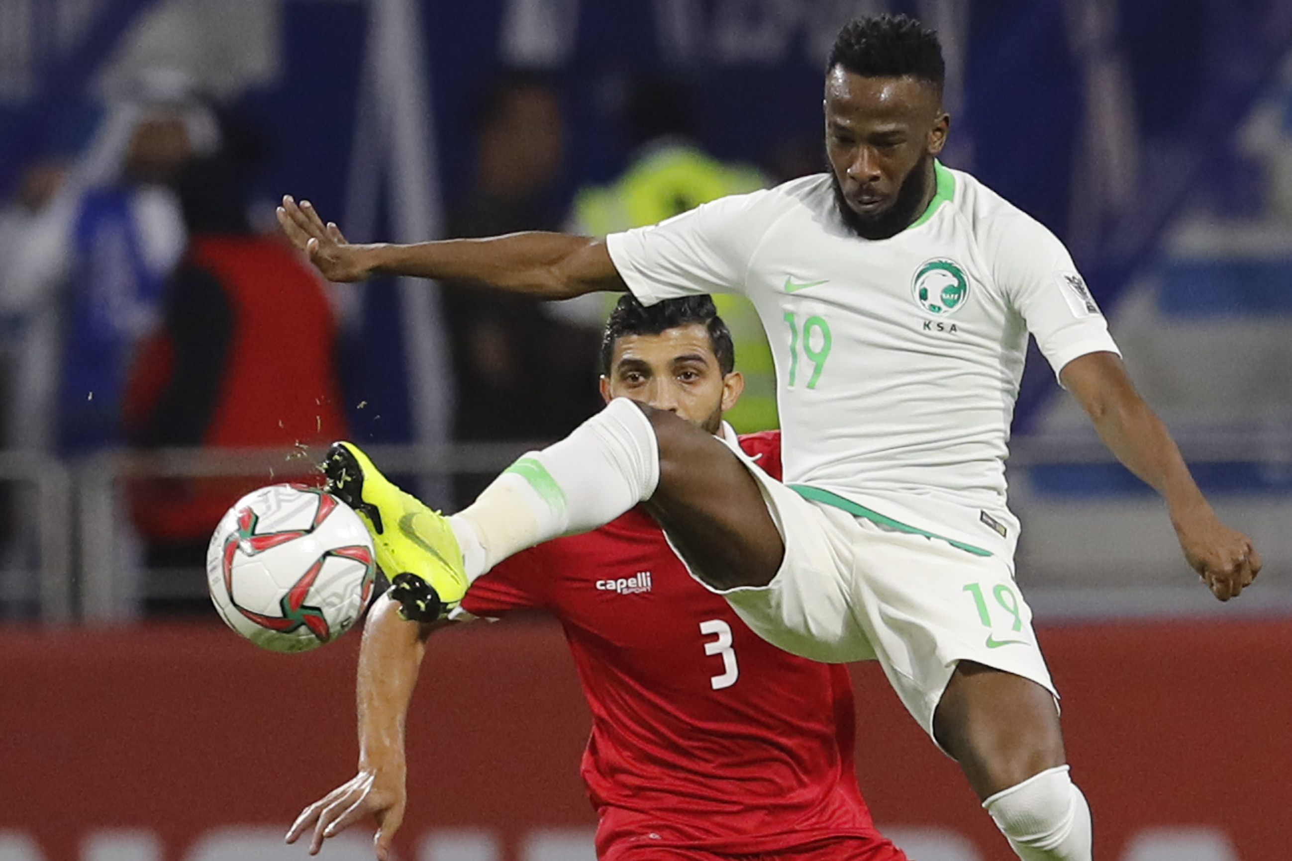FILE - Saudi Arabia's forward Fahad Al Muwallad, foreground, controls the ball against Lebanon's defender Moataz Bellah al Juna, background, during the AFC Asian Cup group E soccer match between Lebanon and Saudi Arabia at Al Maktoum Stadium in Dubai, United Arab Emirates, Saturday, Jan. 12, 2019.