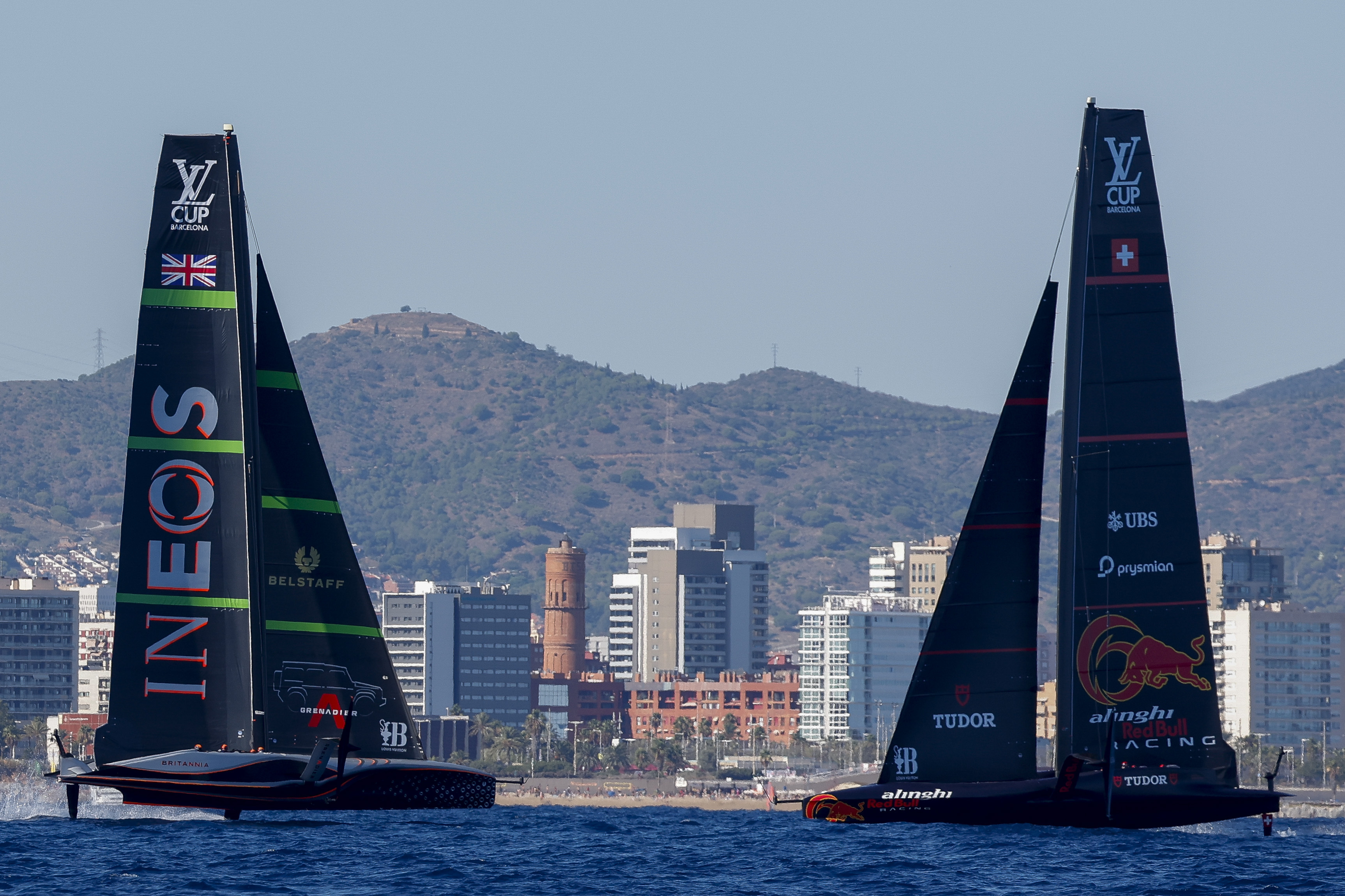 Ineos Britannia's AC75, left, and Alinghi Red Bull Racing's AC75 boats sail during a semi-final America's Cup Regatta ahead of the 37th America's Cup sailing race along the Barcelona's coast, Spain, Saturday, Sep. 14, 2024.