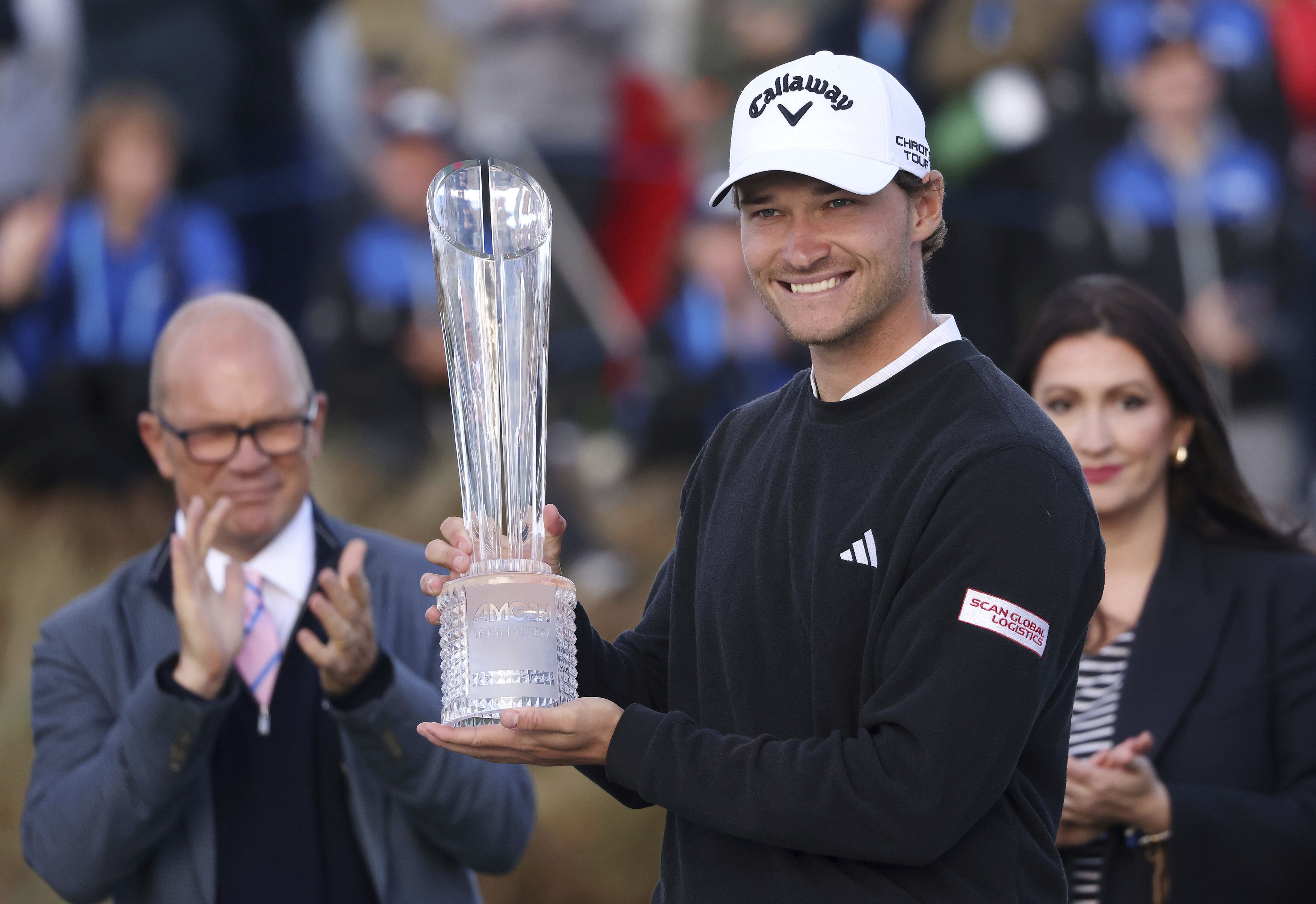 Denmark's Rasmus Hojgaard celebrates with the trophy after winning the Amgen Irish Open 2024 at Royal County Down in Newcastle, County Down, England, Sunday Sept. 15, 2024.