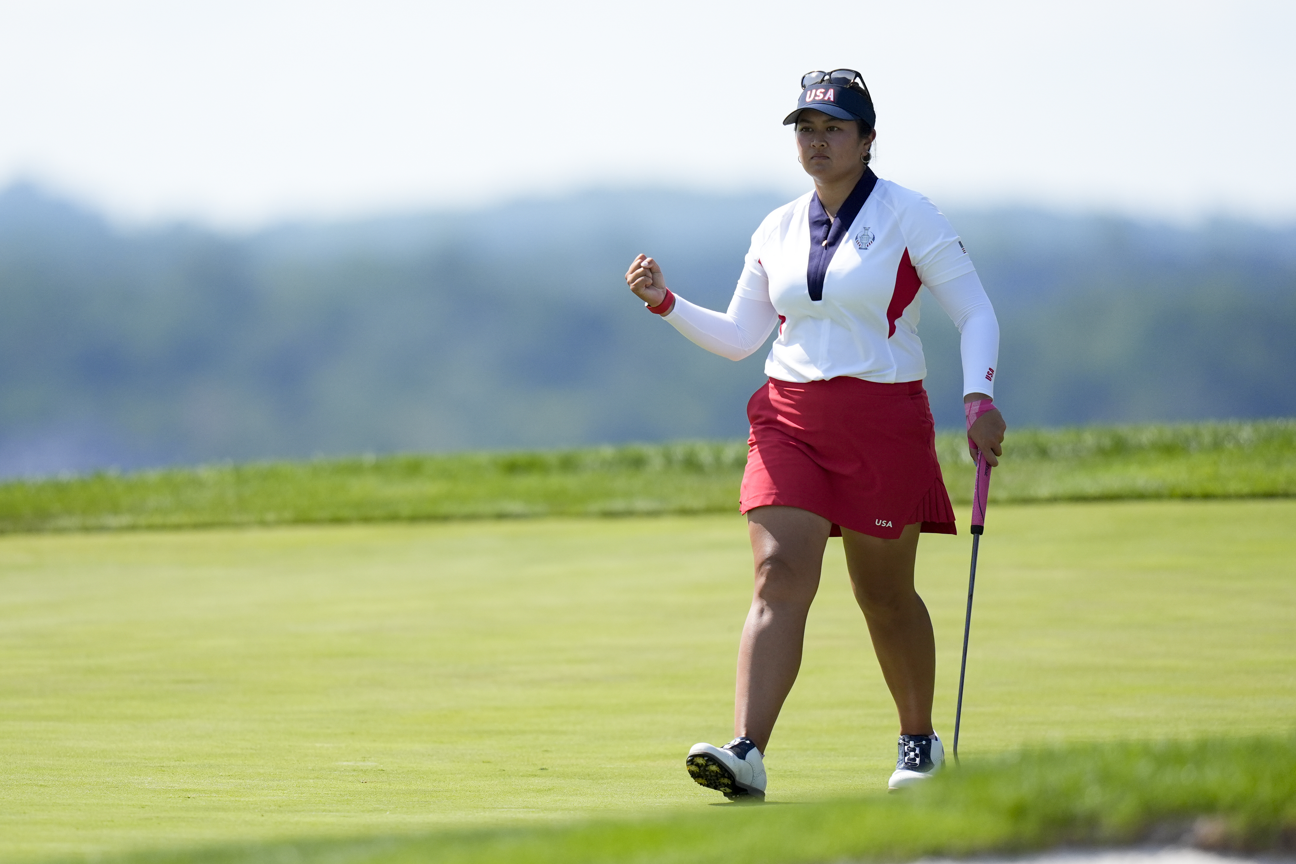 United States' Lilia Vu reacts after making a putt on the 17th green during a Solheim Cup golf tournament singles match at the Robert Trent Jones Golf Club, Sunday, Sept. 15, 2024, in Gainesville, Va.