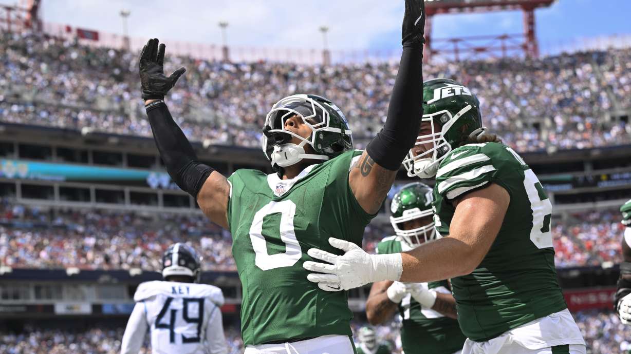 New York Jets running back Braelon Allen (0) celebrates after he scores a touchdown in the first half of an NFL football game against the Tennessee Titans in Nashville, Tenn., on Sunday, Sept. 15, 2024.