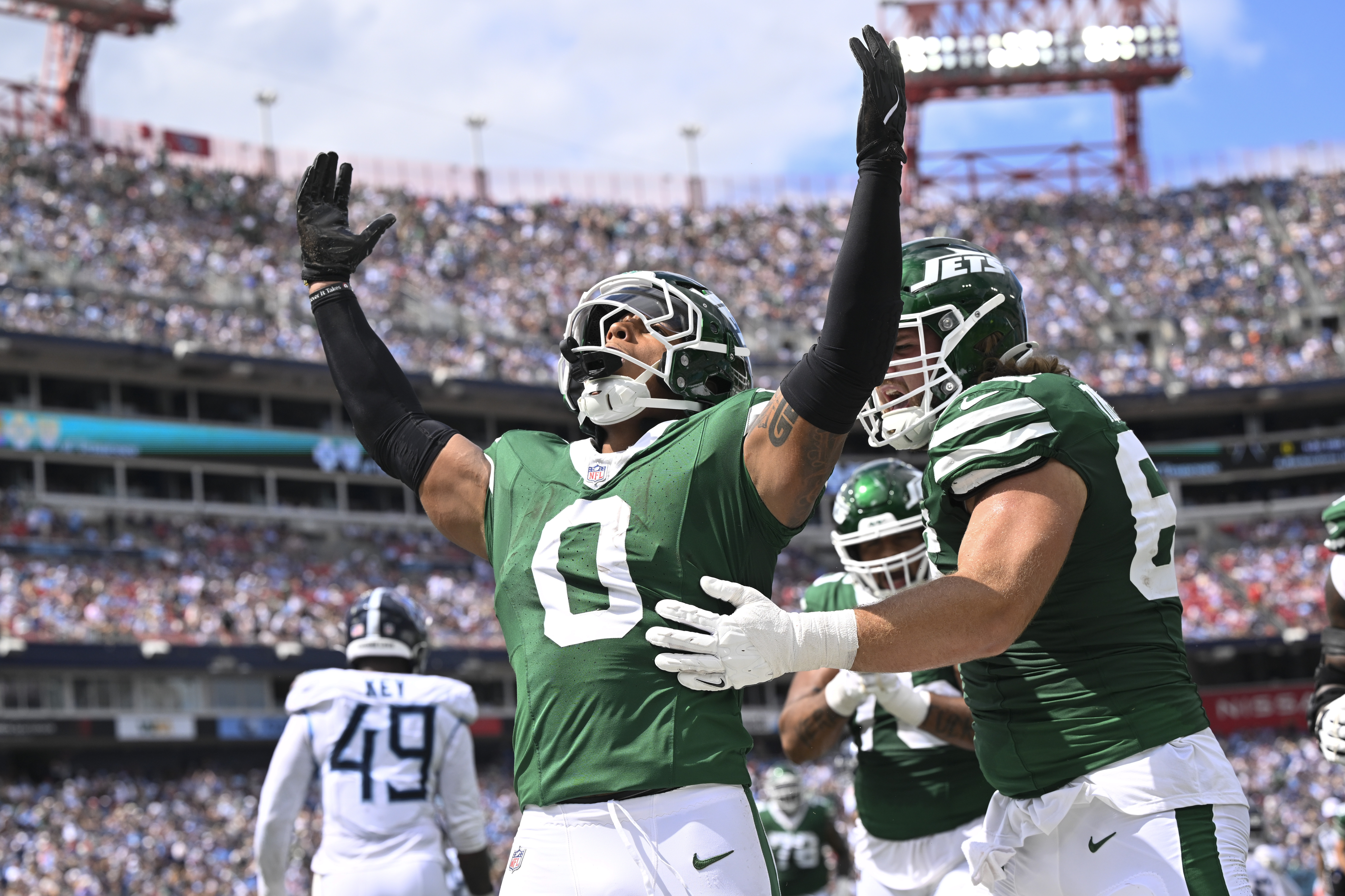 New York Jets running back Braelon Allen (0) celebrates after he scores a touchdown in the first half of an NFL football game against the Tennessee Titans in Nashville, Tenn., on Sunday, Sept. 15, 2024.