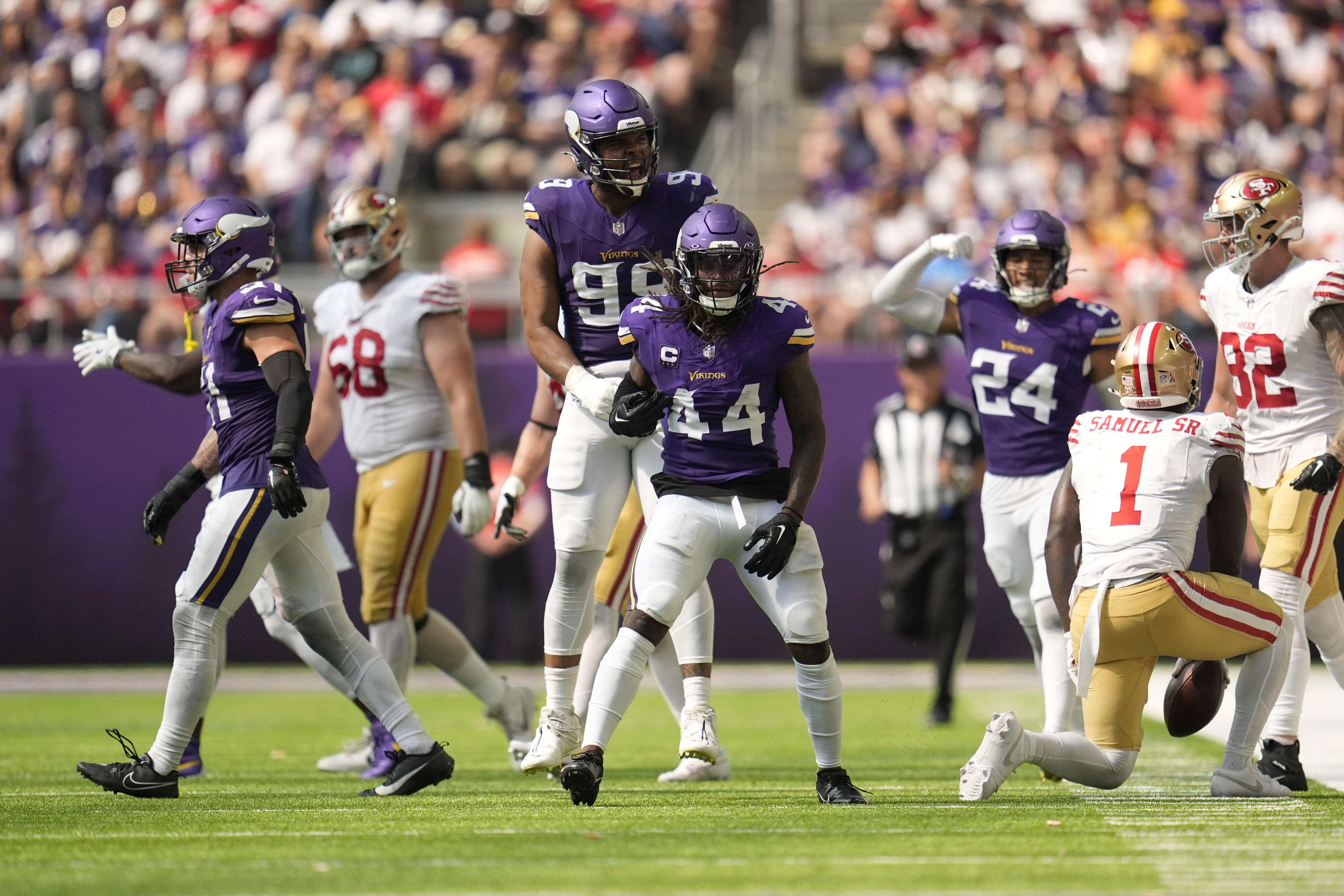 Minnesota Vikings safety Josh Metellus (44) celebrates after making a tackle during the second half of an NFL football game against the San Francisco 49ers, Sunday, Sept. 15, 2024, in Minneapolis.