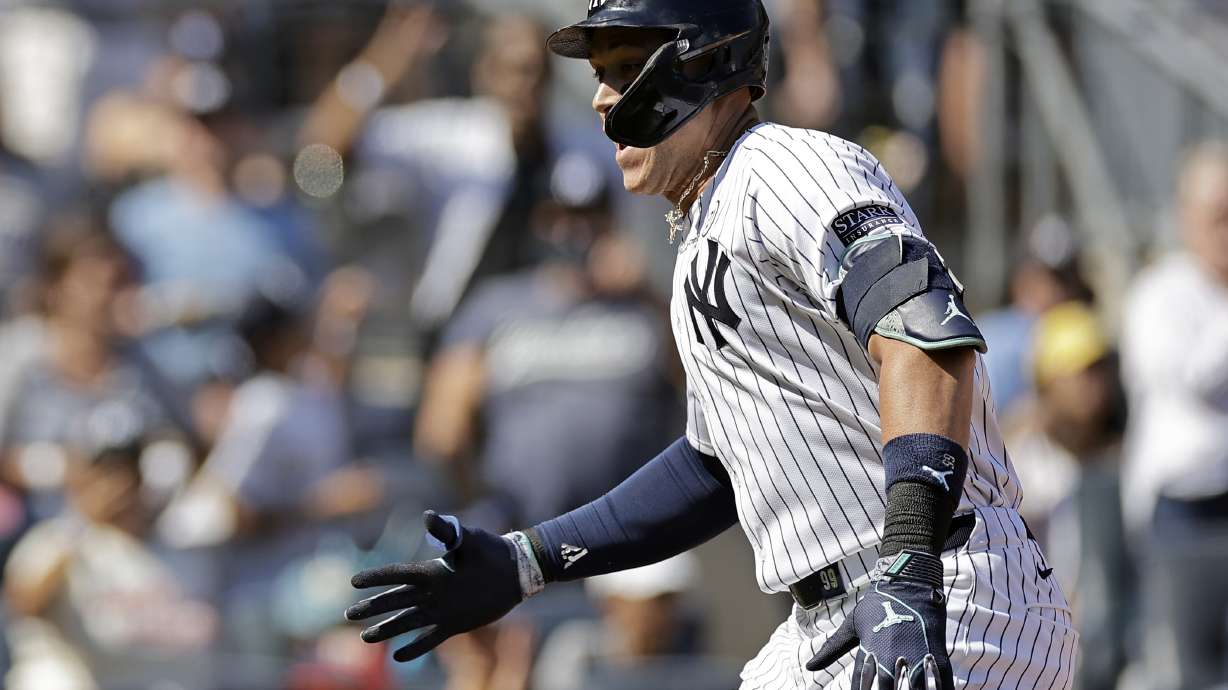 New York Yankees' Aaron Judge reacts after hitting a two-run home run during the third inning of a baseball game against the Boston Red Sox, Sunday, Sept. 15, 2024, in New York.