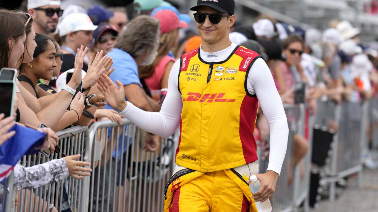 Driver Alex Palou, right, greets fans before an IndyCar auto race Sunday, Sept. 15, 2024, at Nashville Superspeedway in Lebanon, Tenn.