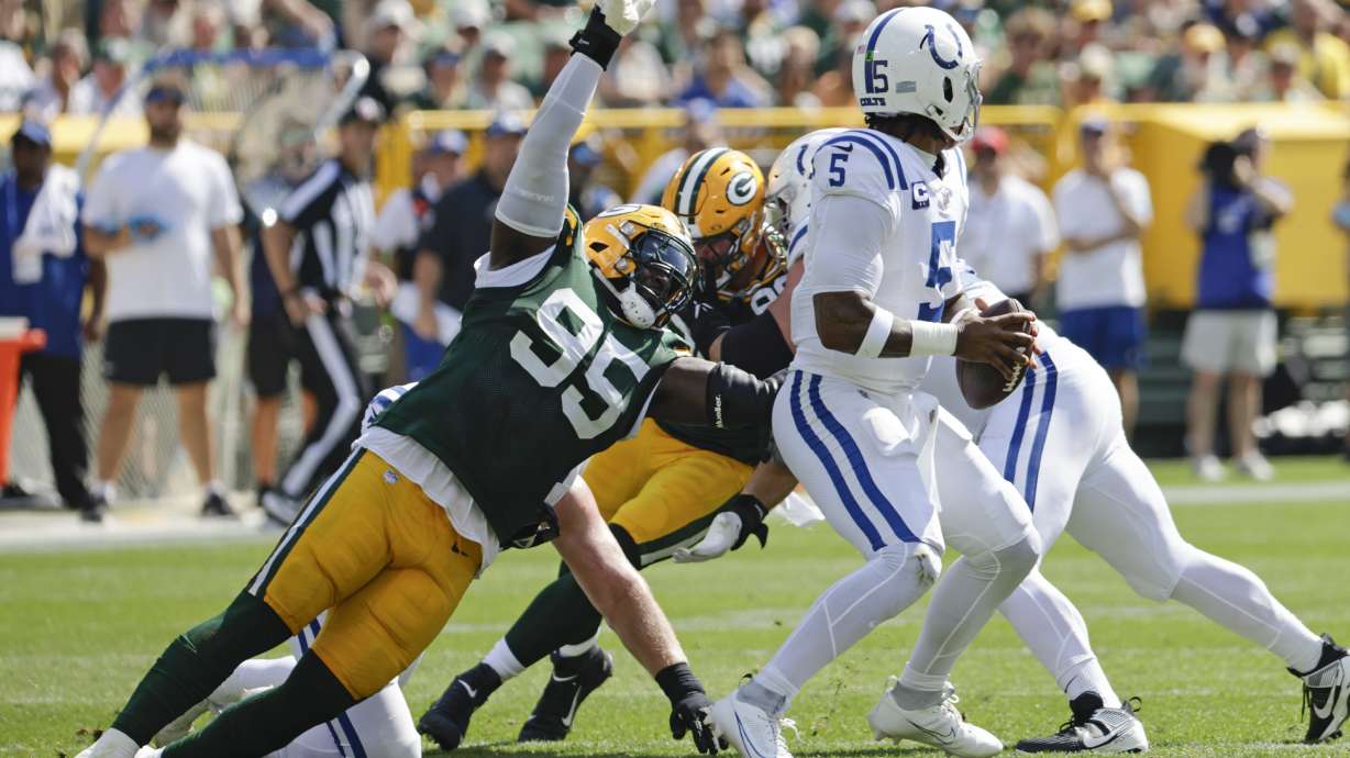 Green Bay Packers defensive tackle Devonte Wyatt (95) sacks Indianapolis Colts quarterback Anthony Richardson (5) during the second half of an NFL football game Sunday, Sept. 15, 2024, in Green Bay, Wis.