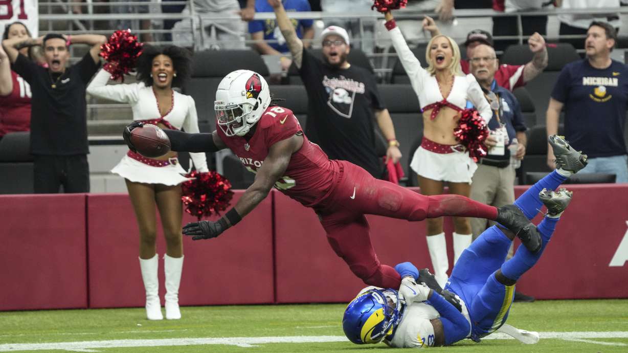 Arizona Cardinals wide receiver Marvin Harrison Jr. makes a touchdown catch against the Los Angeles Rams during the first half of an NFL football game, Sunday, Sept. 15, 2024, in Glendale, Ariz.