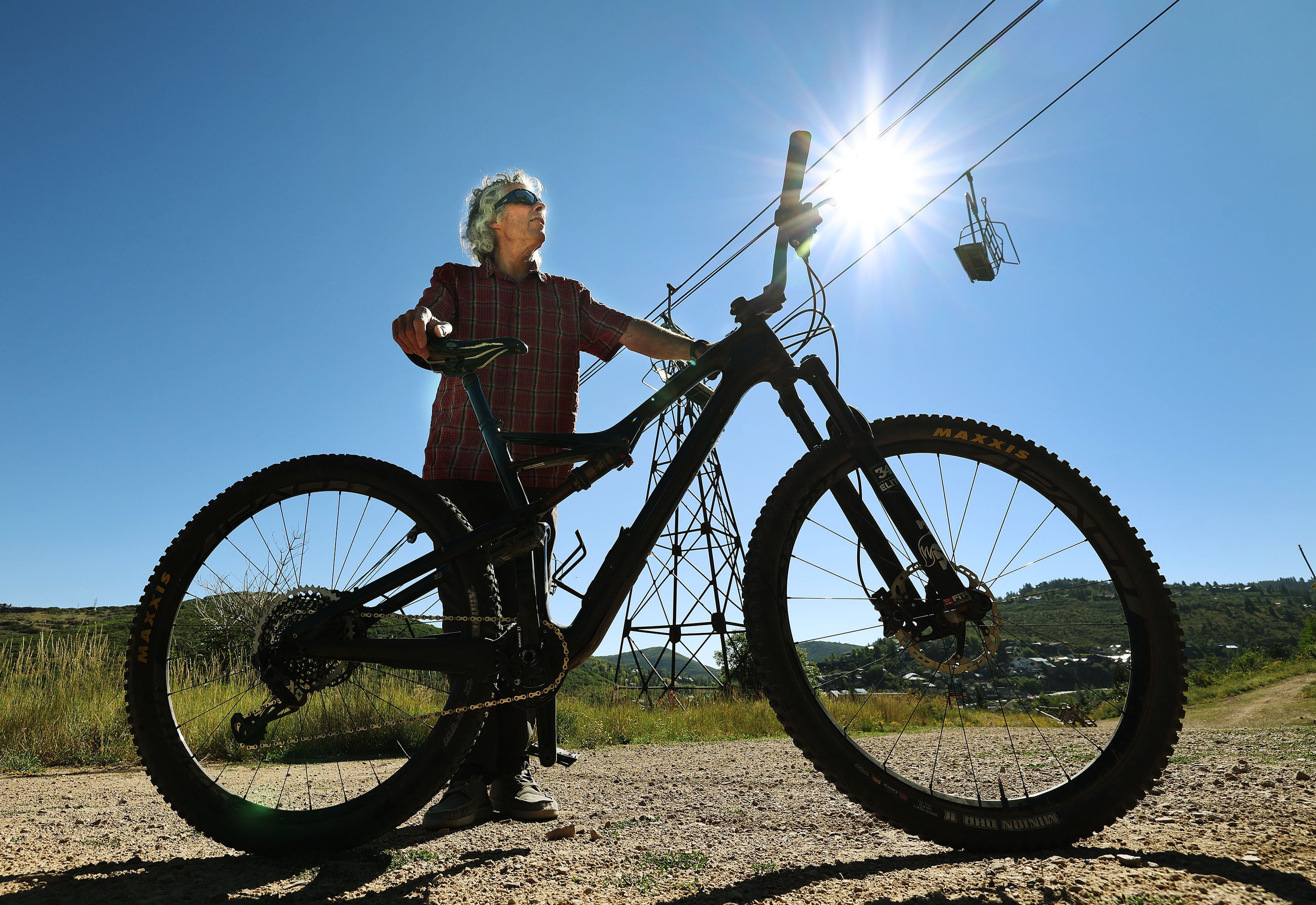 Charlie Sturgis, who has helped build the 500-plus miles of trails used by hikers, bikers and nordic skiers, stands on a trail above old town Park City on Aug. 27.