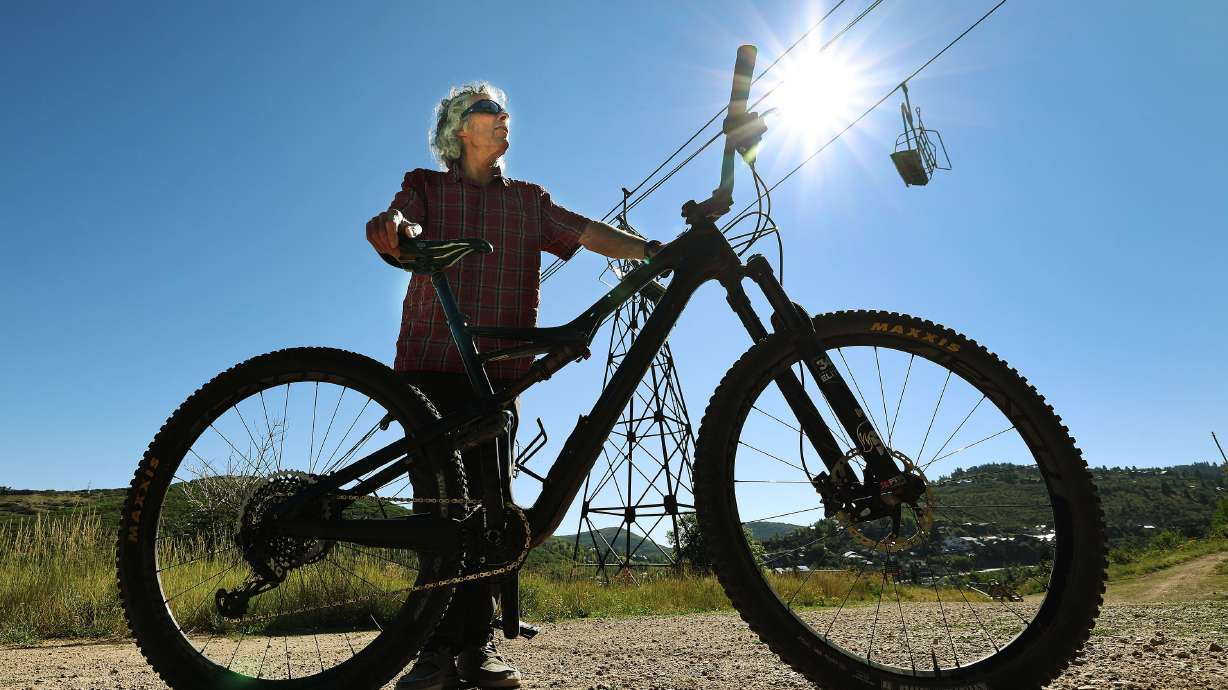 Charlie Sturgis, who has helped build the 500-plus miles of trails used by hikers, bikers and nordic skiers, stands on a trail above old town Park City on Aug. 27.