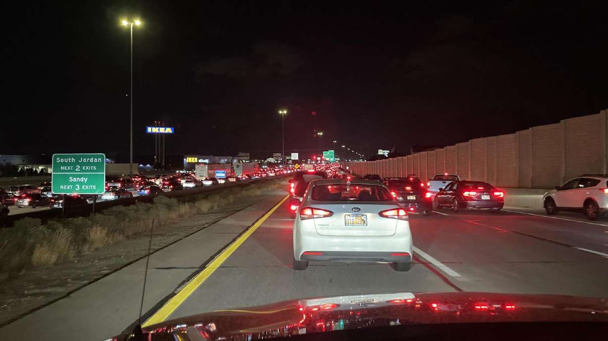 Traffic builds up on the northbound lanes of I-15 at 12300 South. Seven people were hospitalized, including a toddler who was critically injured, during a four-vehicle crash Sunday night.