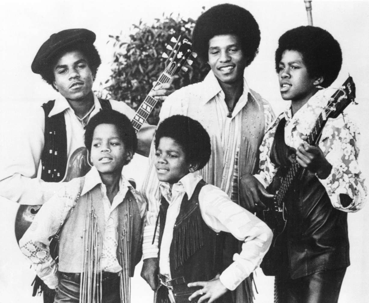 The Jackson 5, Michael Jackson, front right; Marlon Jackson, front left; Tito Jackson, back left; Jackie Jackson, back center; and Jermaine Jackson, back right; pose for this undated photo together in Los Angeles. Tito Jackson has died at age 70.
