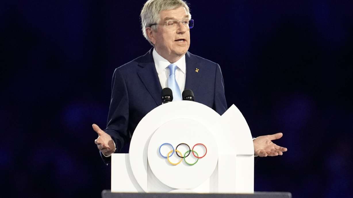 FILE - IOC President Thomas Bach addresses the audience during the 2024 Summer Olympics closing ceremony at the Stade de France, Aug. 11, 2024, in Saint-Denis, France.