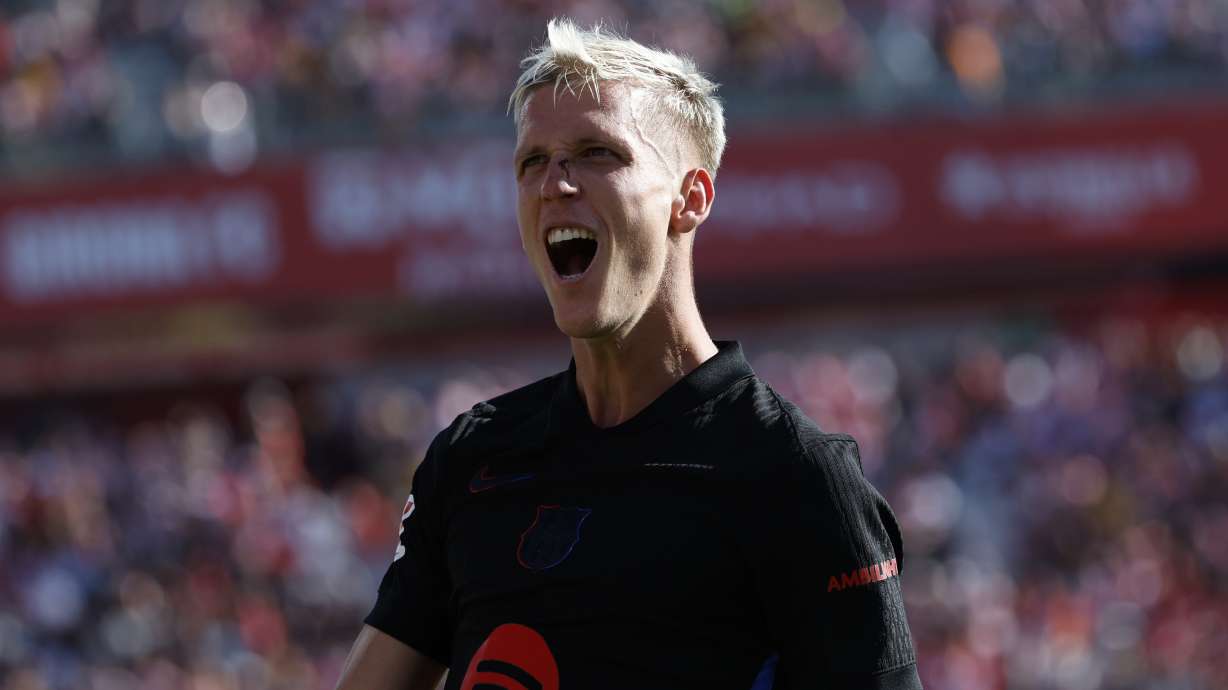 Barcelona's Dani Olmo celebrates after scoring his side's third goal during the Spanish La Liga soccer match between Girona and Barcelona at the Montilivi stadium in Girona, Spain, Sunday, Sept. 15, 2024.