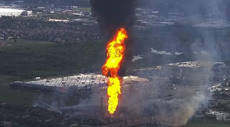 Firefighters work on the scene of a pipeline fire in La Porte, Texas, Monday.