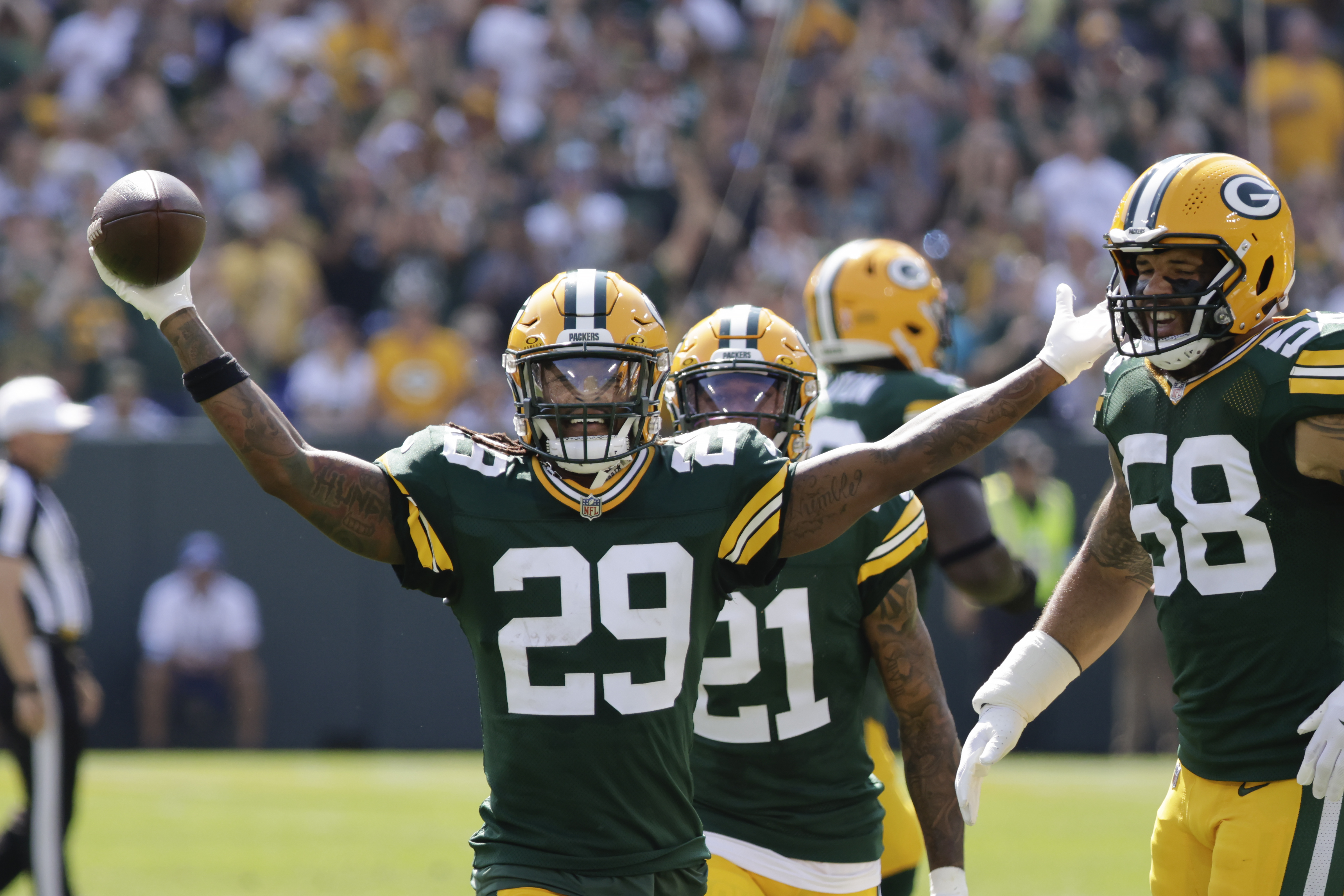 Green Bay Packers safety Xavier McKinney (29) reacts after intercepting a pass during the first half of an NFL football game against the Indianapolis Colts Sunday, Sept. 15, 2024, in Green Bay, Wis.