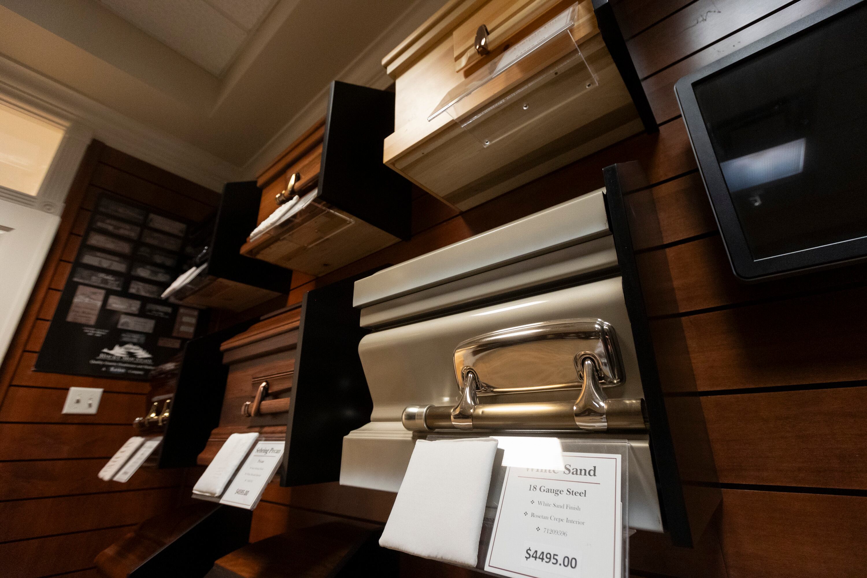 Display coffins are pictured at Larkin Sunset Lawn Mortuary, Mausoleum, Cemetery and Crematorium in Salt Lake City on Aug. 16.