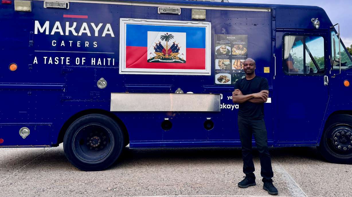 Roody Salvator, originally from Haiti, runs a food truck in Salt Lake City that features Haitian cuisine. He's pictured with his truck on Monday, Sept. 16, 2023.