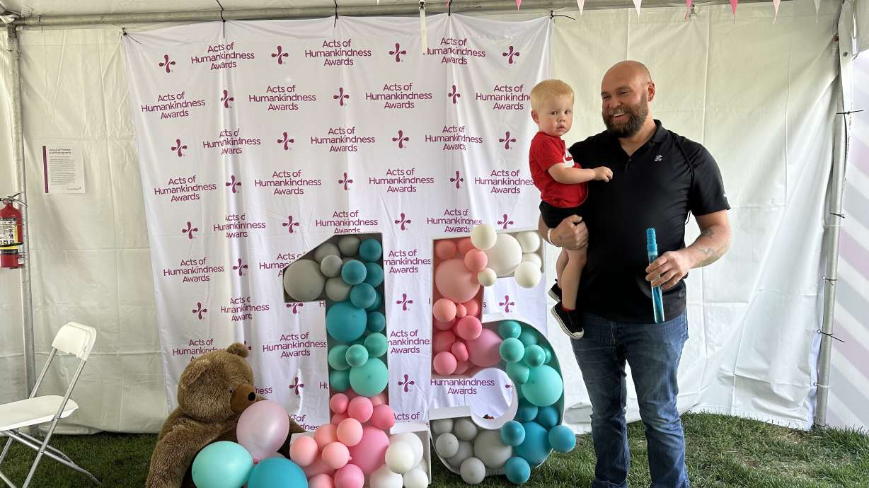 Mike Leavitt holds his son Griffin at a NICU reunion to celebrate 15 years of the NICU at Holy Cross Hospital Jordan Valley.