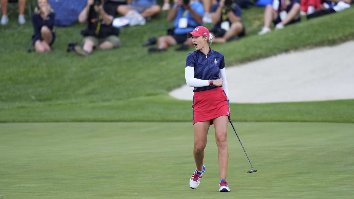 United States' Nelly Korda celebrates after sinking a putt on the 14th hole to win a fourball match during a Solheim Cup golf tournament at Robert Trent Jones Golf Club, Friday, Sept. 13, 2024, in Gainesville, Va.