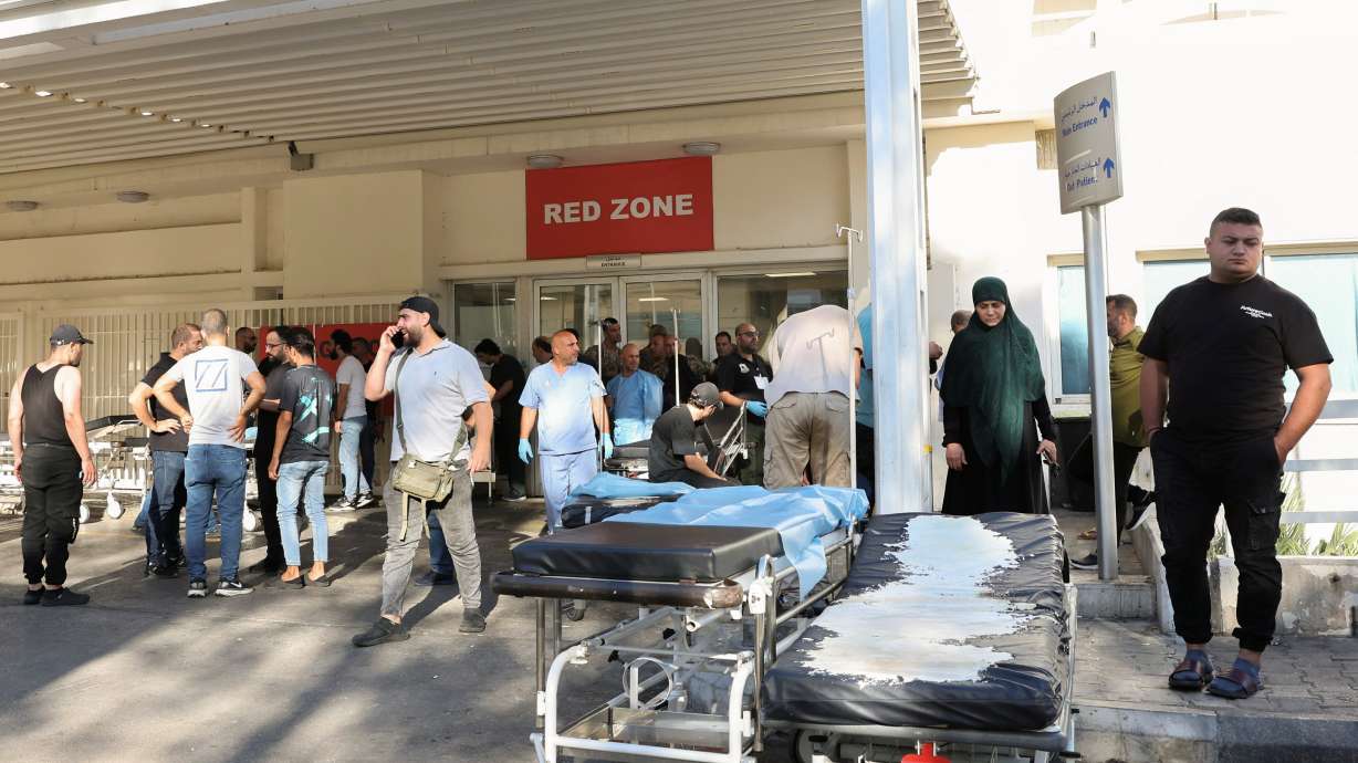 People gather outside a hospital, as hundreds of members of the Lebanese armed group Hezbollah, including fighters and medics, were seriously wounded on Tuesday when the pagers they use to communicate exploded, according to a security source, in Beirut, Lebanon, Tuesday.