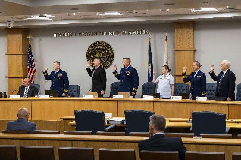 Coast Guard members of the investigative board for the Titan marine board formal hearing take an oath inside the Charleston County Council Chambers Monday in North Charleston, S.C.