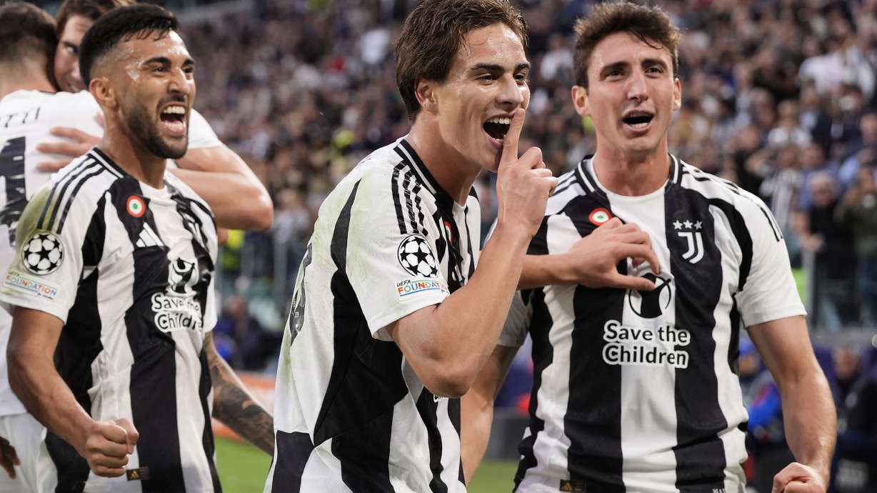 Juventus' Kenan Yildiz, center, celebrates after scoring the opening goal during the Champions League opening phase soccer match between Juventus and PSV Eindhoven at the Juventus stadium in Turin, Italy, Tuesday, Sept. 17, 2024.