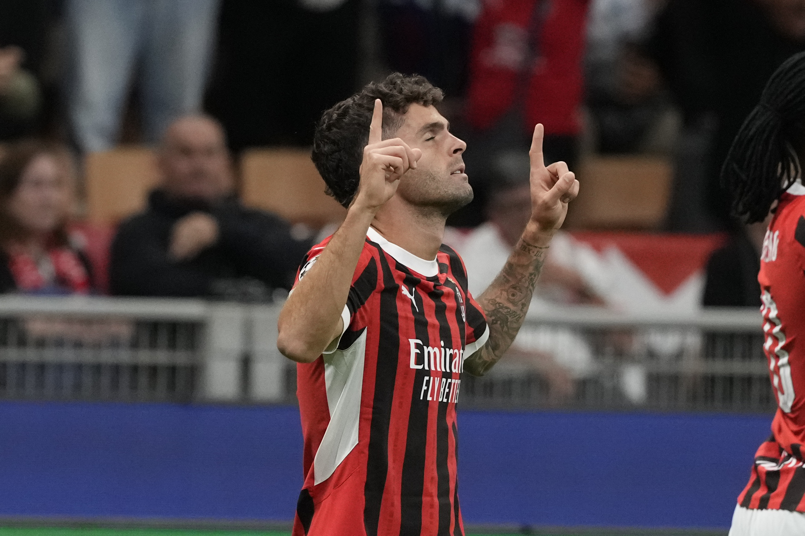 AC Milan's Christian Pulisic celebrates scoring his side's opening goal during the Champions League opening phase soccer match between AC Milan and Liverpool at the San Siro stadium in Milan, Italy, Tuesday, Sept. 17, 2024.