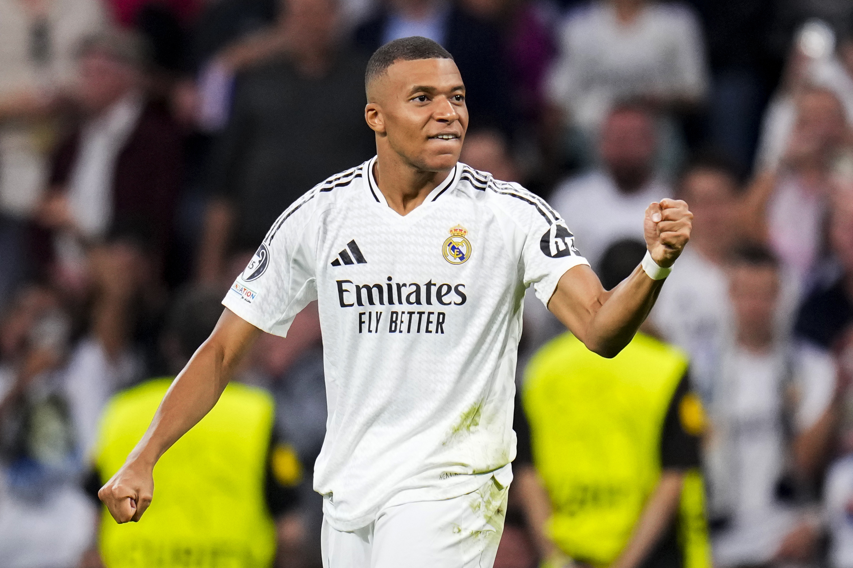 Real Madrid's Kylian Mbappe celebrates after scoring the opening goal during the Champions League opening phase soccer match between Real Madrid and VfB Stuttgart at the Santiago Bernabeu stadium, in Madrid, Tuesday, Sept. 17, 2024. 