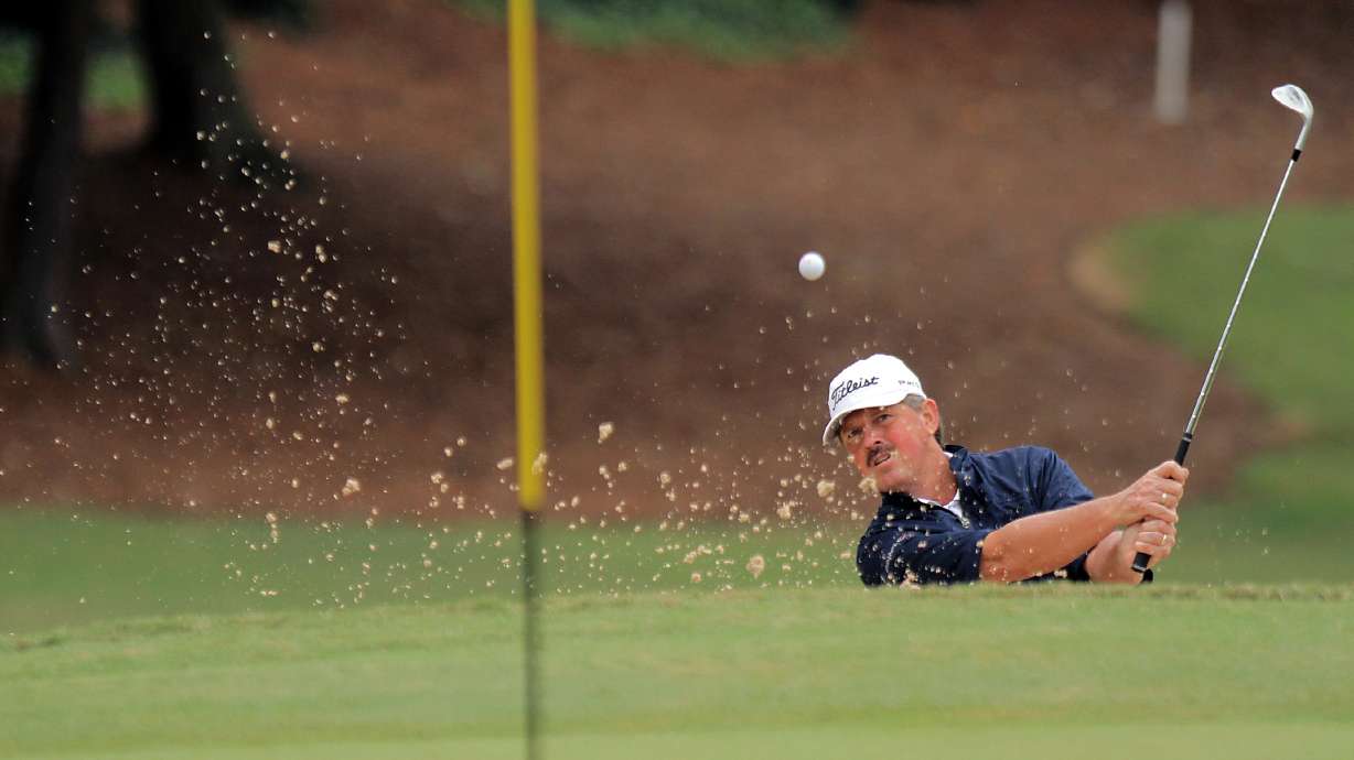 Jay Don Blake hits from a bunker up to the fifth green during the final round of the SAS PGA Champions Tour golf tournament at Prestonwood Country Club in Cary, N.C., Sunday, Oct. 7, 2012. Blake finished in second place.