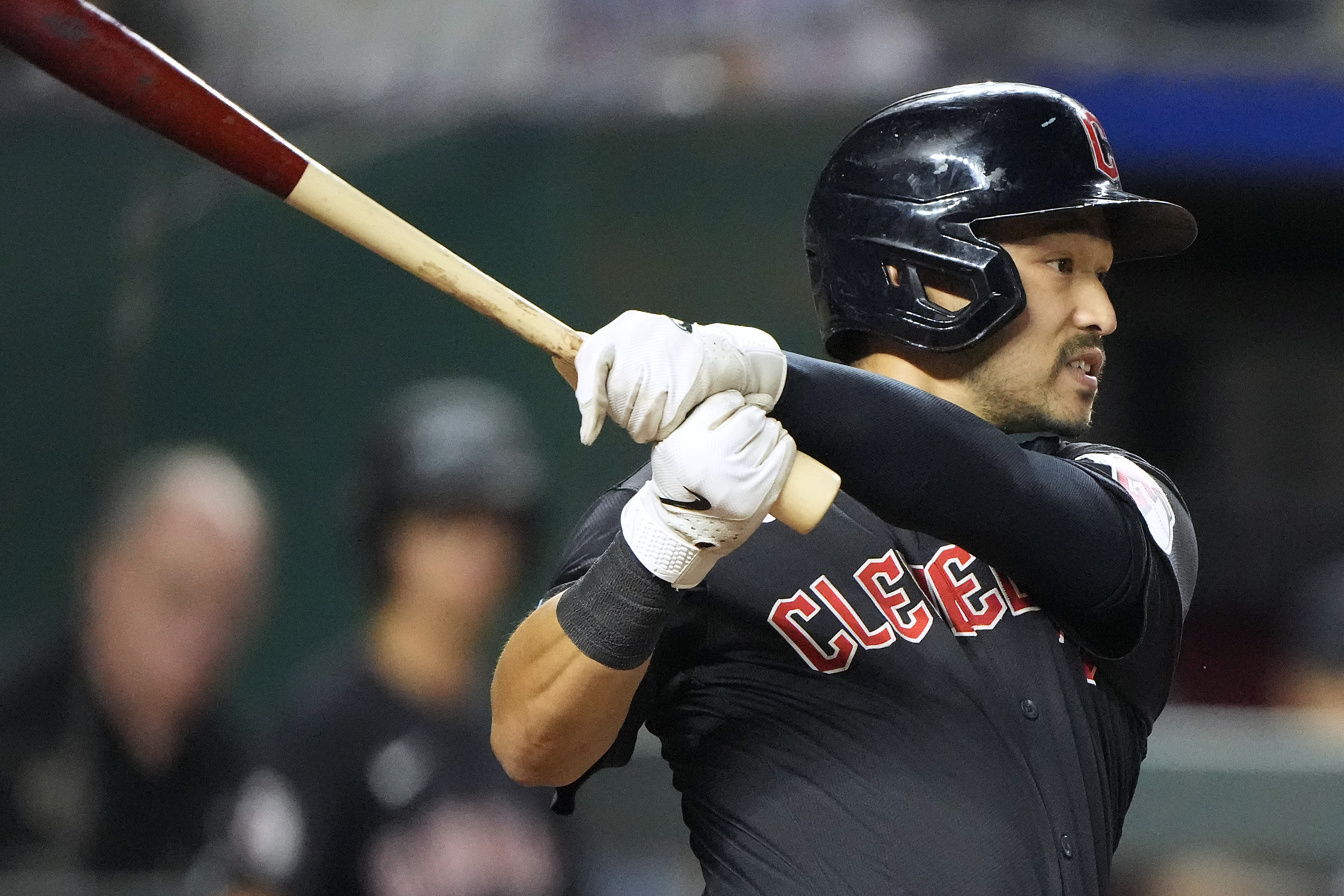 Cleveland Guardians' Steven Kwan watches hit two-run single during the eighth inning of a baseball game against the Kansas City Royals Tuesday, Sept. 3, 2024, in Kansas City, Mo.