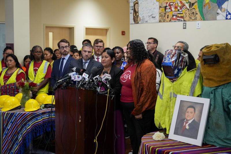 Maria del Carmen Castellón, center, the wife of Miguel Luna, a welder who died during the collapse of Baltimore's Francis Scott Key Bridge, speaks during a press conference, Tuesday in Baltimore.