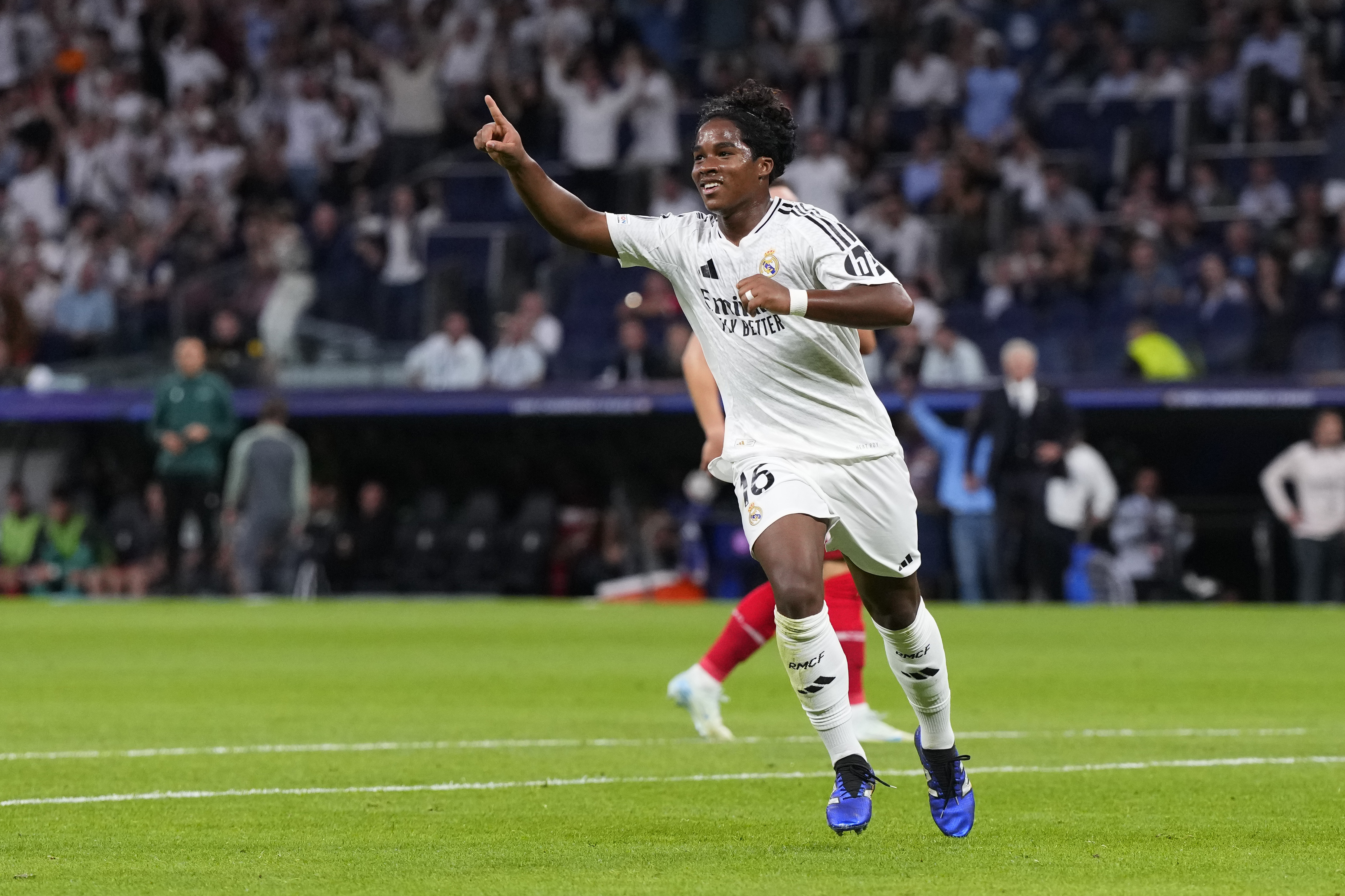 Real Madrid's Endrick celebrates after scoring his side's third goal during the Champions League opening phase soccer match between Real Madrid and VfB Stuttgart at the Santiago Bernabeu stadium, in Madrid, Tuesday, Sept. 17, 2024. Real Madrid won 3-1.