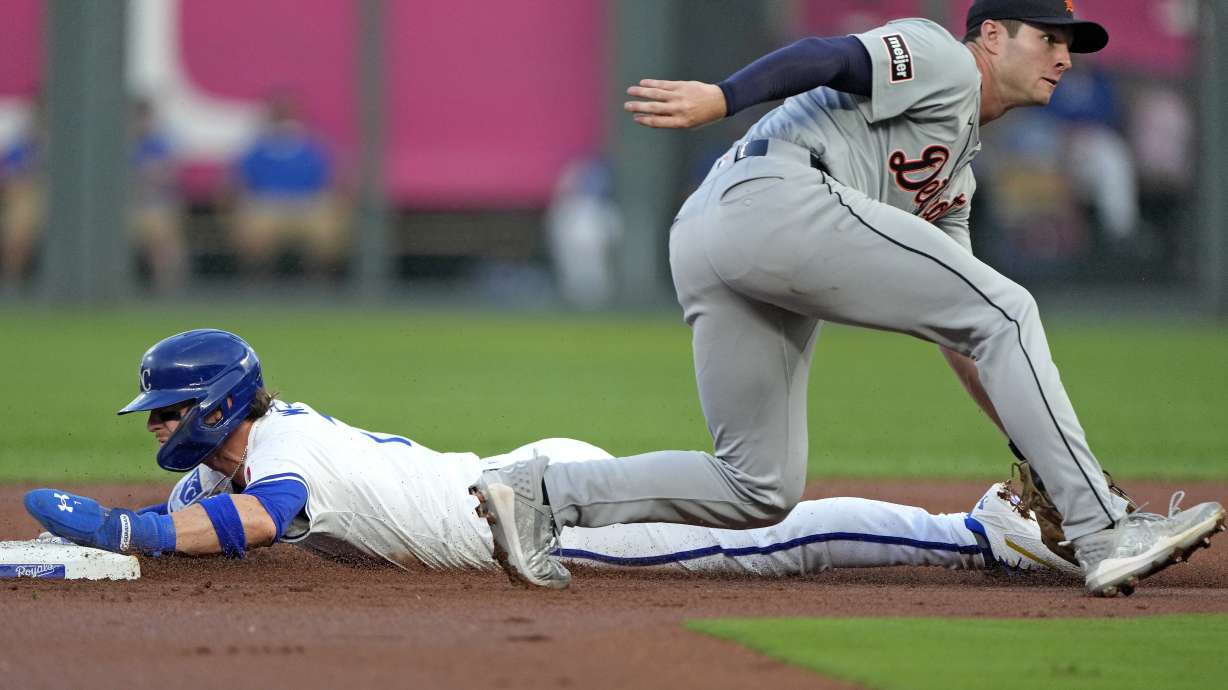 Kansas City Royals' Bobby Witt Jr. beats the tag by Detroit Tigers second baseman Colt Keith to steal second during the first inning of a baseball game Tuesday, Sept. 17, 2024, in Kansas City, Mo.