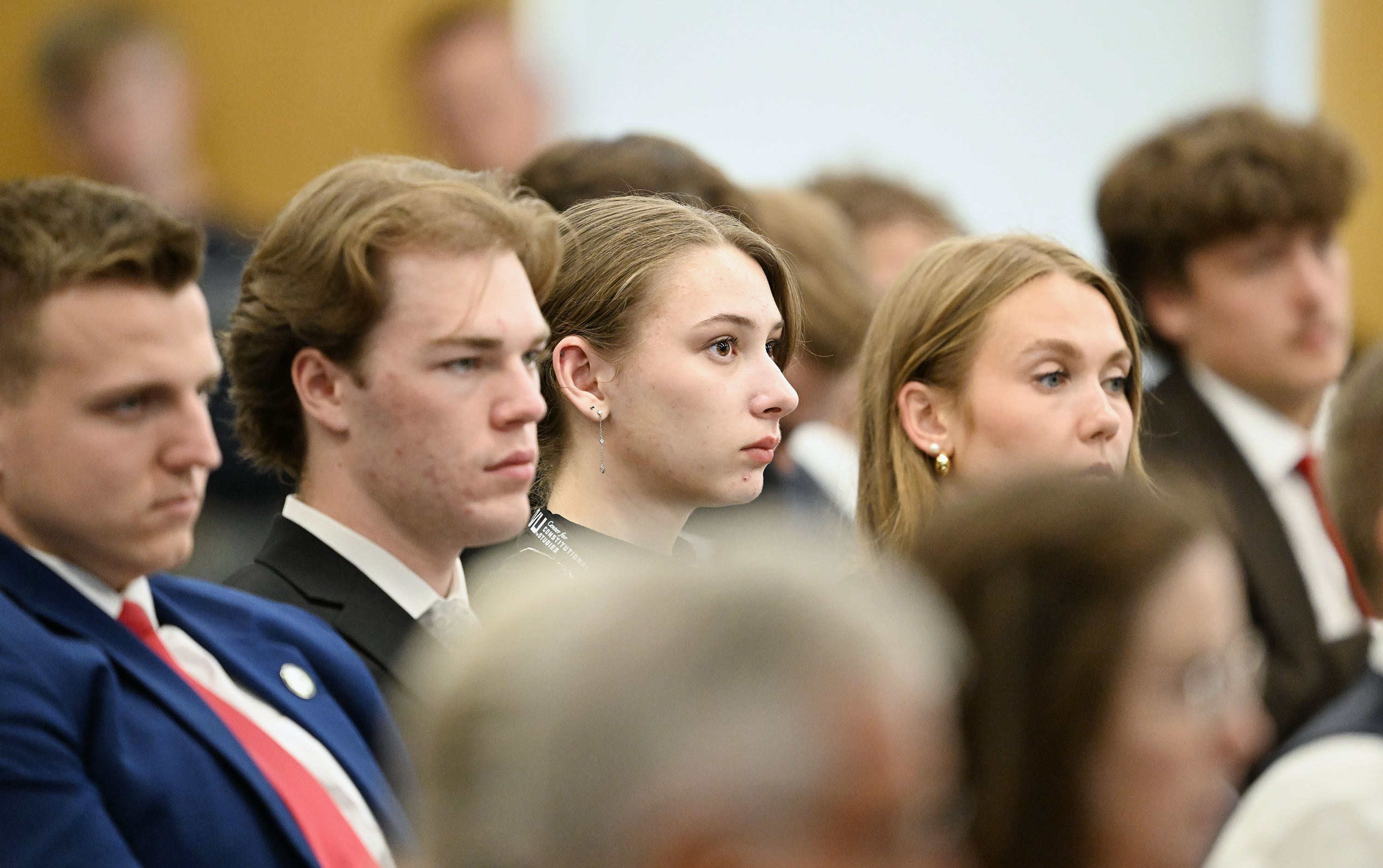 Audience members listen as Matthew Brogdon, Ryan Bell, Savannah Eccles Johnston and Derek Monson take part in a panel discussion about Ballot Initiatives in Utah, in Orem at UVU on Tuesday.