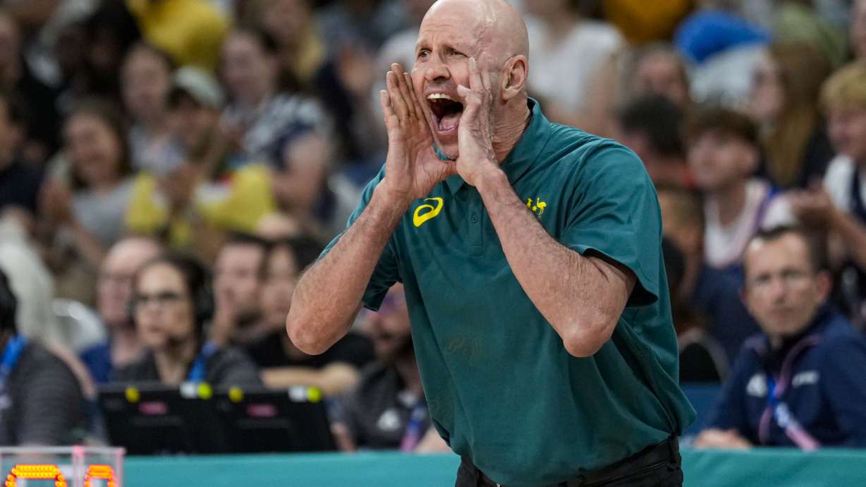 FILE - Australia head coach Brian Goorjian yells to his team in a men's basketball game against Spain at the 2024 Summer Olympics, July 27, 2024, in Villeneuve-d'Ascq, France.