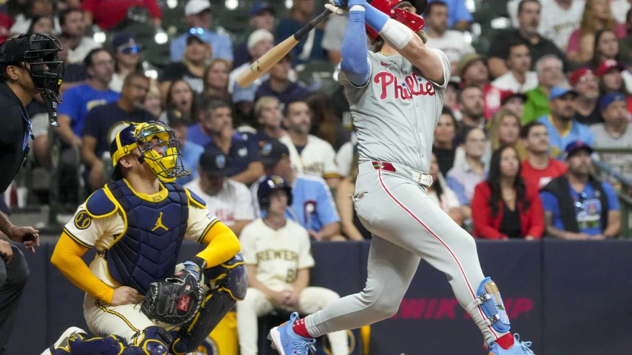 Philadelphia Phillies' Bryce Harper hits a two-run homr run during the sixth inning of a baseball game against the Milwaukee Brewers Tuesday, Sept. 17, 2024, in Milwaukee.