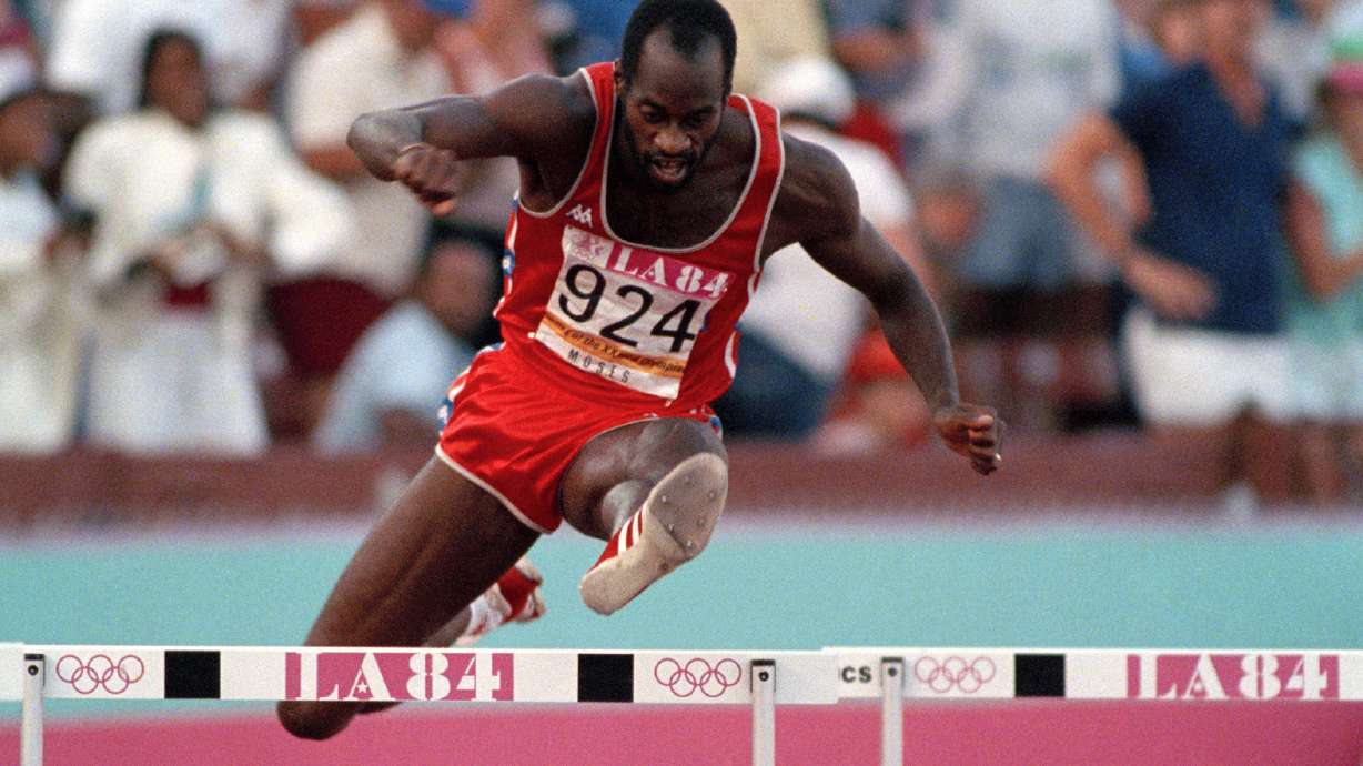 FILE - United States' Edwin Moses jumps a hurdle on his way to winning the gold medal in the 400-meter hurdles at the Summer Olympic Games in Los Angeles, Aug. 5, 1984.