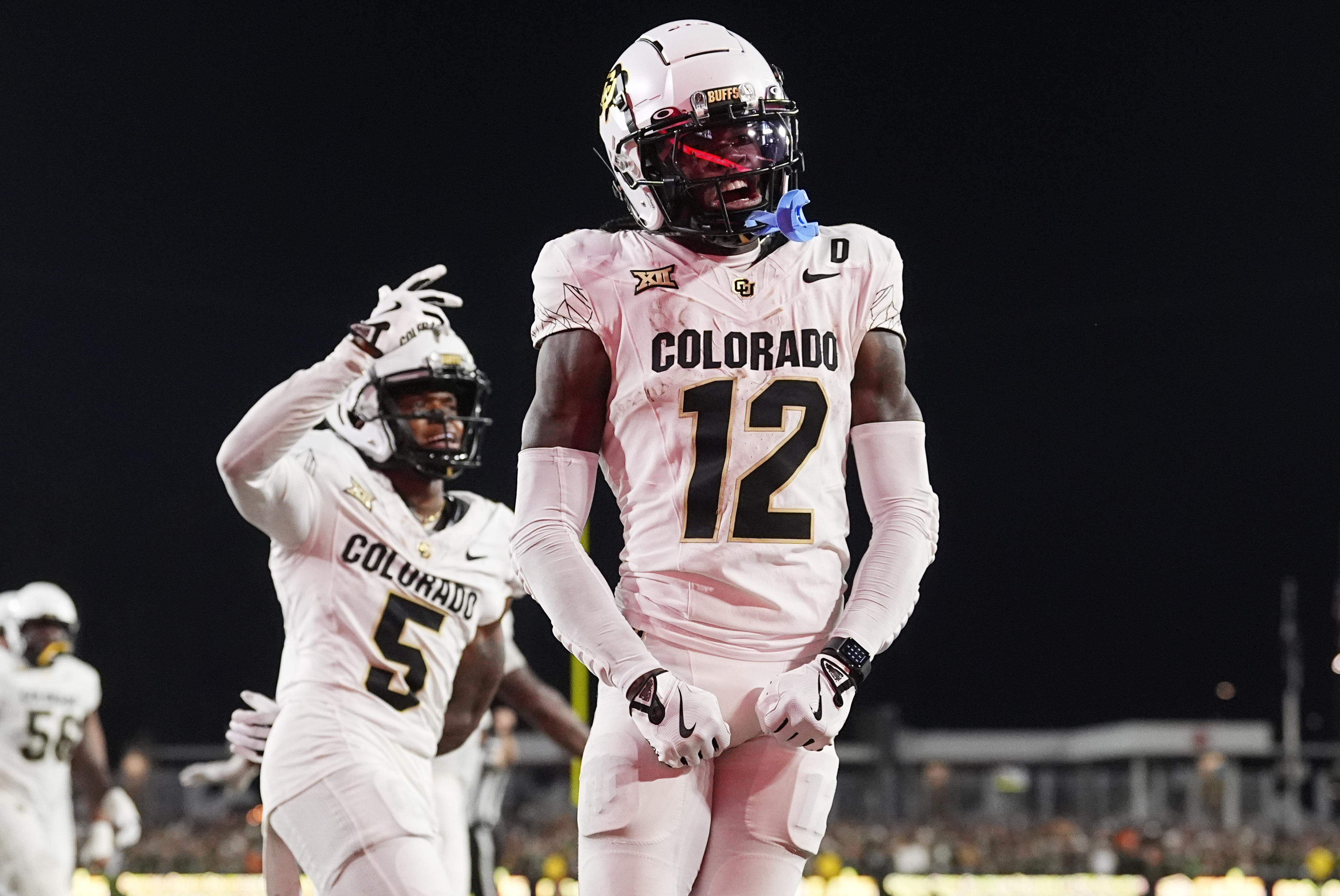 Colorado wide receiver Travis Hunter, right, celebrates after catching a touchdown pass as wide receiver Jimmy Horn Jr. (5) joins in during the second half of an NCAA college football game against Colorado State, Saturday, Sept. 14, 2024, in Fort Collins, Colo.